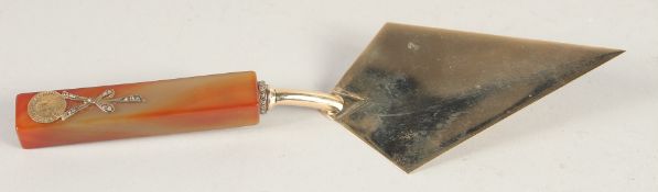 A RUSSIAN 14CT GOLD TROWEL WITH JADE HANDLE, with medallions in diamonds. 8ins long, mark H. W. head