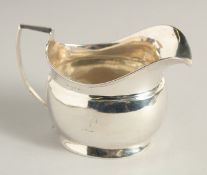 A GEORGE III SILVER MILK JUG. London 1806.