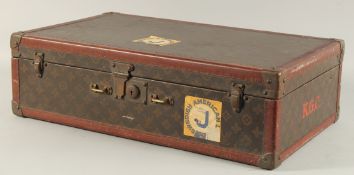 A LOUIS VUITTON SUITCASE. No. 788153, with Louis Vuitton label. Brass lock 113, with two labels