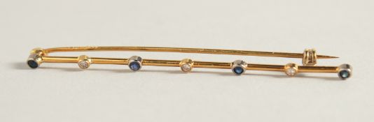 A SAPPHIRE AND DIAMOND 18ct GOLD BAR BROOCH.