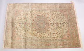 A GOOD SHIRVAN SILK RUG, pink ground with all over floral decoration. 6ft 5ins x 4ft 3ins.