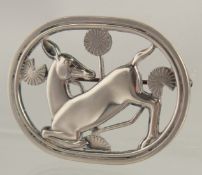 A GEORG JENSEN SILVER DEER BROOCH.