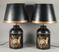 A PAIR OF BLACK TOLEWARE CANNISTER LAMPS AND SHADES 1ft 7ins high.