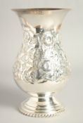 A MATCHING CONTINENTAL SILVER PLATED VASE. with floral repousse decoration. 9.5ins high.