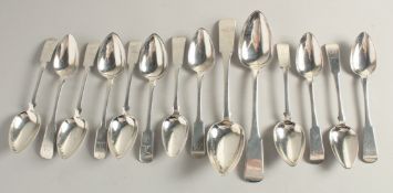 A SET OF TWELVE SILVER FIDDLE PATTERN DESSERT SPOONS AND TWO TABLESPOONS by CHARLES MURRAY. Weight