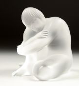 A LALIQUE FROSTED GLASS FIGURE sitting crossed leg. Signed. 3ins in a Lalique box.