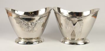 A PAIR OF OVAL CHAMPAGNE COOLERS WITH WINGS 1ft 2ins wide.