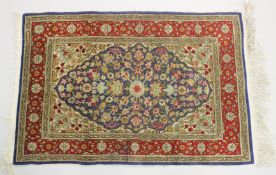 A GOOD SMALL SHIRVAN SILK RUG, blue ground with floral decoration in a red ground border. 3ft 1ins x