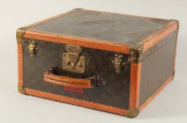 A LOUIS VUITTON HAT BOX with key. No. 104637. Bought from Saks & Co., Fifth Avenue, New York.