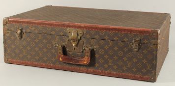A LOUIS VUITTON SUITCASE. Louis Vuitton label missing. Lock no. H9. 27.5ins long x 18.5ins wide x