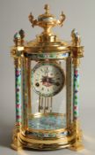A GOOD GILT METAL AND CLOISONNE ENAMEL CIRCULAR COLUMN CLOCK with urn finial. 1ft 6ins high.