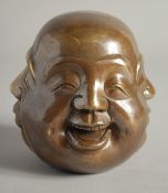 A BRASS FOUR FACE BUDDHA. Signed, 4.5ins