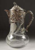 A BULBOUS ENGRAVED GLASS CLARET JUG with plated mounts, lid and handle. 11ins high.