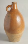 A LARGE EARLY STONEWARE FLAGON. 16ins high.