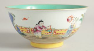 A CHINESE FAMILLE ROSE PORCELAIN BOWL the interior with turquoise glaze. 17cm diameter.