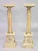 A GOOD PAIR OF CLUSTER COLUMNS on pedestal bases. 3ft 3ins high.