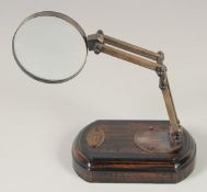 A MAGNIFYING GLASS on a stand.