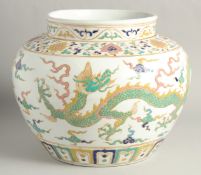 A VERY LARGE CHINESE SANCAI PORCELAIN JAR, decorated with dragons beneath a band of lotus and