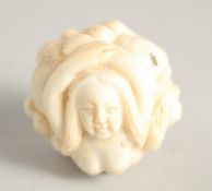 A CHINESE CARVED BALL NETSUKE 