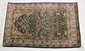 A GOOD SMALL PERSIAN RUG SHIRVAN OR ISFAHAN, dark blue ground with deer and exotic birds amongst
