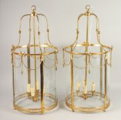 A VERY GOOD PAIR OF GILT CIRCULAR LANTERNS with glass panels. 2ft 8ins high x 1ft 3ins diameter.