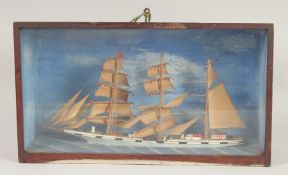 A MODEL OF A SHIP in a glass case. Case, 19ins x 12ins.