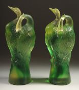 A GOOD PAIR OF TITTOT GREEN GLASS ENTWINED BIRDS. Signed 6.5ins high.