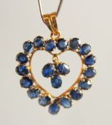 AN 18CT GOLD HEART SHAPED SAPPHIRE PENDANT.