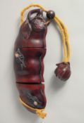 A LARGE CARVED WOOD FRUIT INRO. 7ins long,
