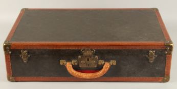 A LOUIS VUITTON SUITCASE. No. 816144, with Louis Vuitton label. Pull-out tray. Lock No. 107170.