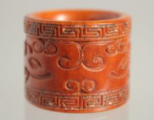 A CARVED BONE ARCHER'S RING. 1.25ins.