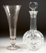 A CUT GLASS PORT DECANTER AND STOPPER and a TULIP GLASS VASE. (2).