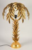 A GILT METAL PALM TREE TABLE LAMP. 2ft 4ins high.