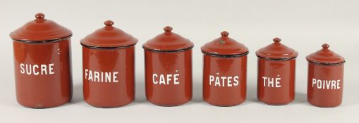 A SET OF ENAMEL STORAGE JARS.