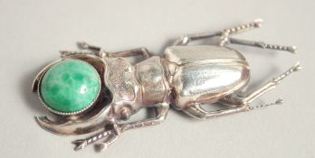 A SILVER SCARAB BROOCH.