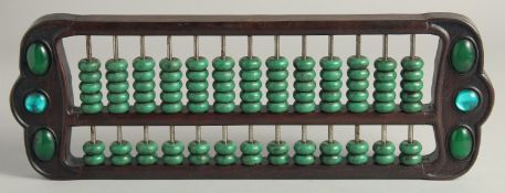 A CHINESE TURQUOISE BEADED HARDWOOD ABACUS.