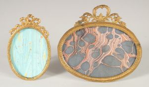 TWO FRENCH OVAL GILT PHOTOGRAPH FRAMES. 3ins x 2ins & 3ins x 4.5ins.