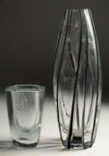A SMALL PLAIN SWEDISH GLASS VASE. Signed. 4.75ins high, and a TALL VASE with applied stripes,