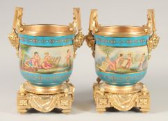 A GOOD PAIR OF SEVRES STYLE PORCELAIN AND GILT METAL CACHE POTS. 1ft 1ins high.