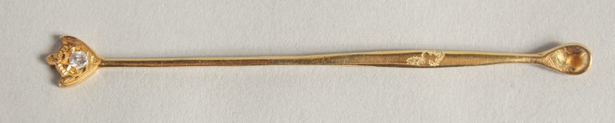 AN 18CT GOLD DIAMOND SET COKE SPOON.