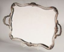 A GOOD SILVER PLATED SQUARE TWO HANDLED TEA TRAY. 24ins long.