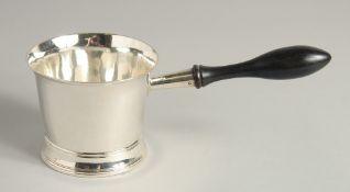 A GEORGE III SILVER BRANDY PAN with turned wood handle. 3.75ins diameter. London 1804. Maker Peter