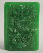 A CHINESE CARVED DRAGON JADE PENDANT. 2ins