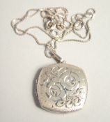 A SILVER LOCKET AND CHAIN.