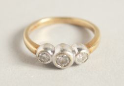 A THREE STONE DIAMOND RING.