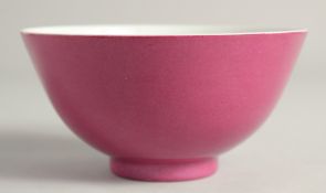 A CHINESE PINK GLAZE PORCELAIN BOWL six character mark to base, 14cm diameter.