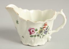 AN 18TH CENTURY WORCESTER LOW CHELSEA EWER with acanthus moulded base painted with polychrome