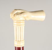 A CARVED BONE HANDLE WALKING STICK, 'HAND'. 3ft long