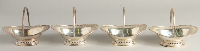 A SET OF FOUR SMALL SILVER OVAL PIERCED BASKETS with swing handles. Sheffield 1893, maker Atkin