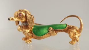 AN 18CT GOLD, RUBY, DIAMOND, AND GREEN ENAMEL DACHSHUND BROOCH BY FRASCAROLO.